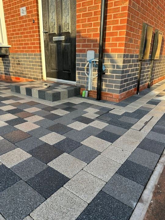 Block-paved front garden path and step in a grey checkerboard pattern by North West Landscapes
